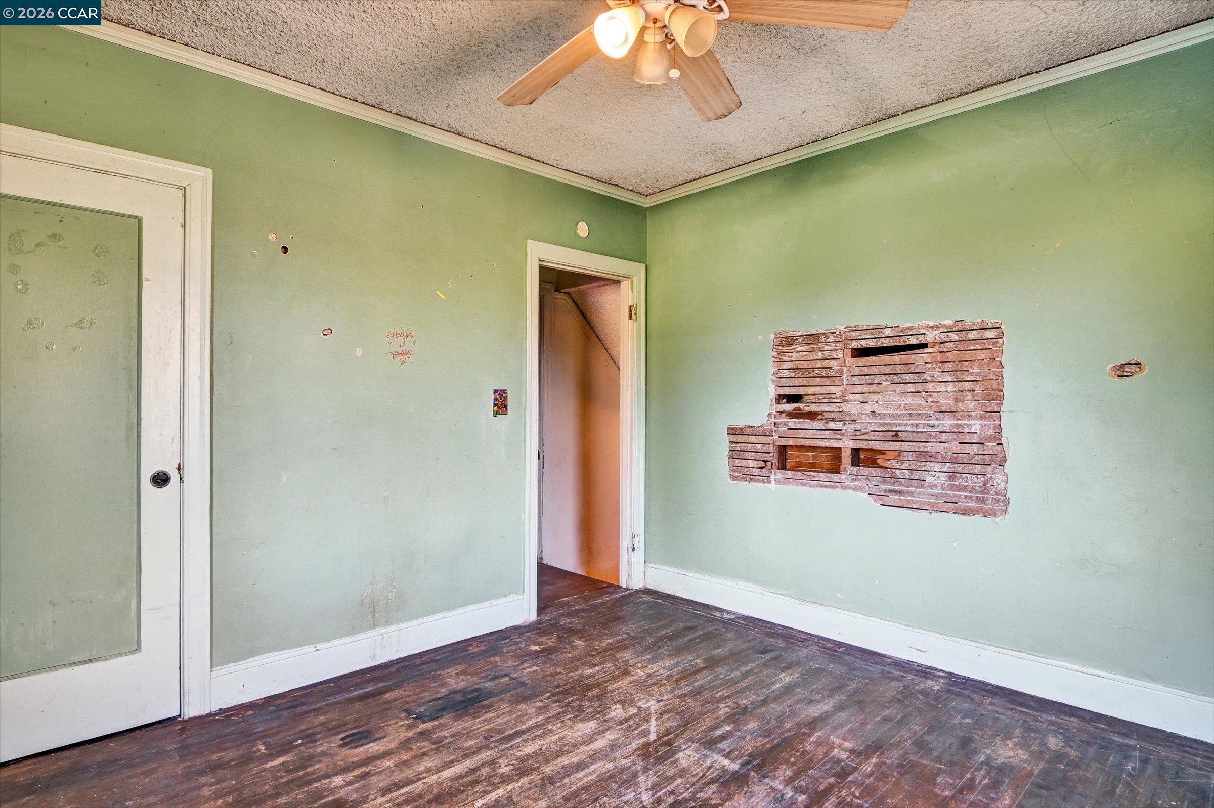 1711 Carleton Street Berkeley, CA 94703 - Photo 24 of 40 an empty room with a fan & a window