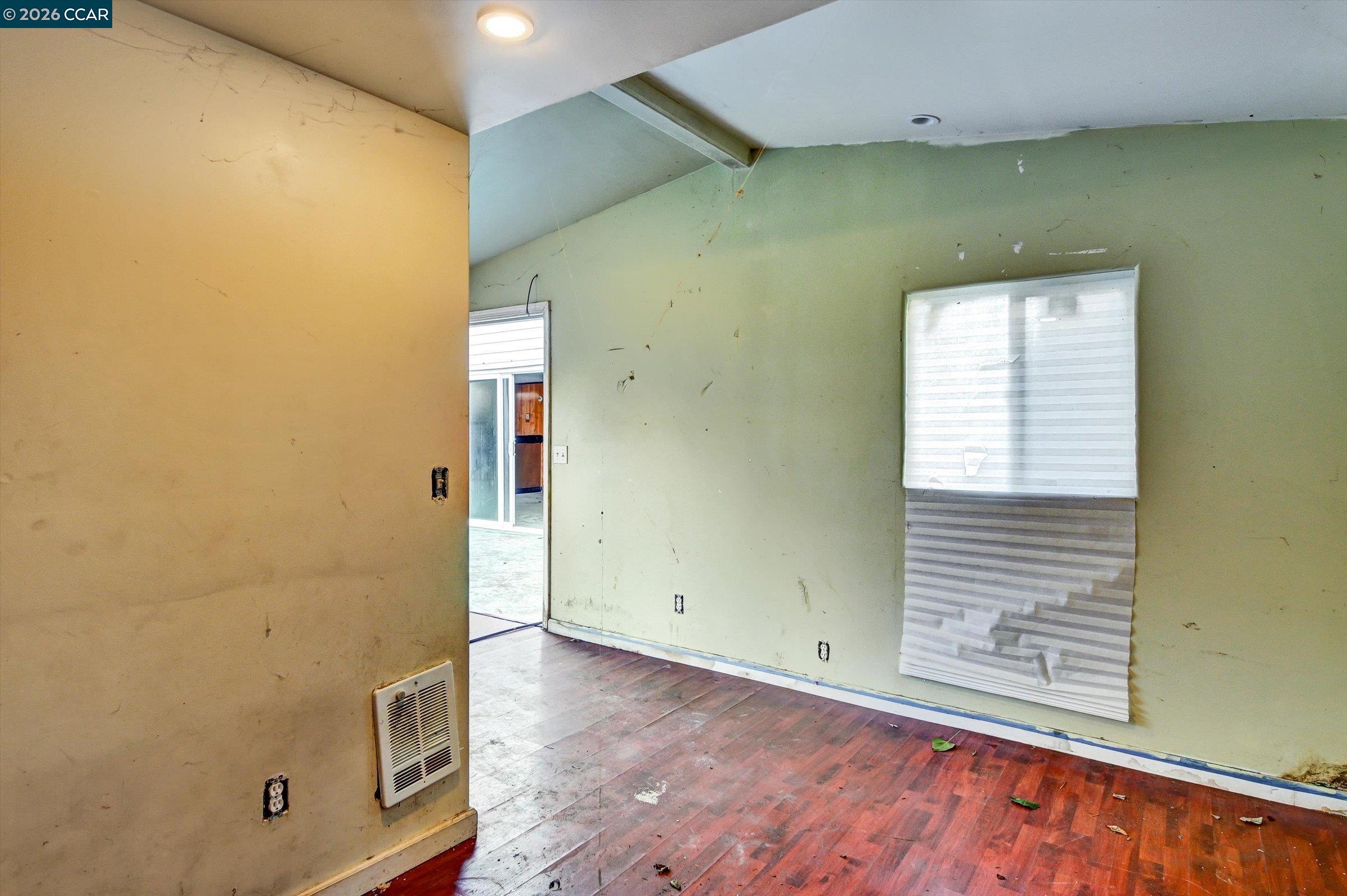 1711 Carleton Street Berkeley, CA 94703 - Photo 37 of 40 an empty room with wooden floor and windows