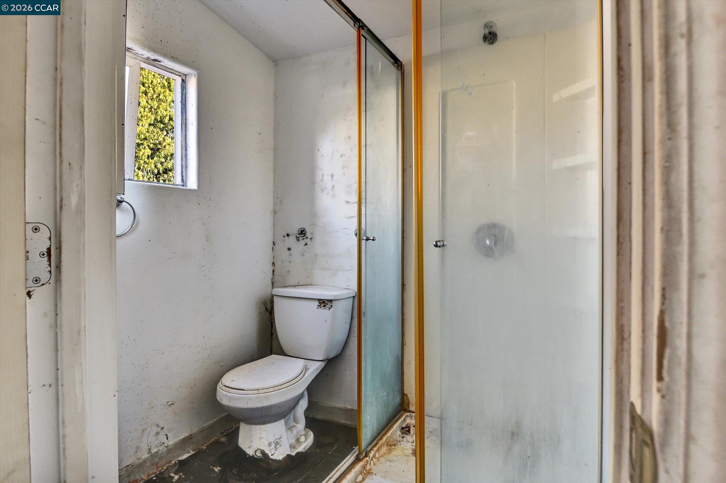 1711 Carleton Street Berkeley, CA 94703 - Photo 39 of 40 a bathroom with a toilet and a shower