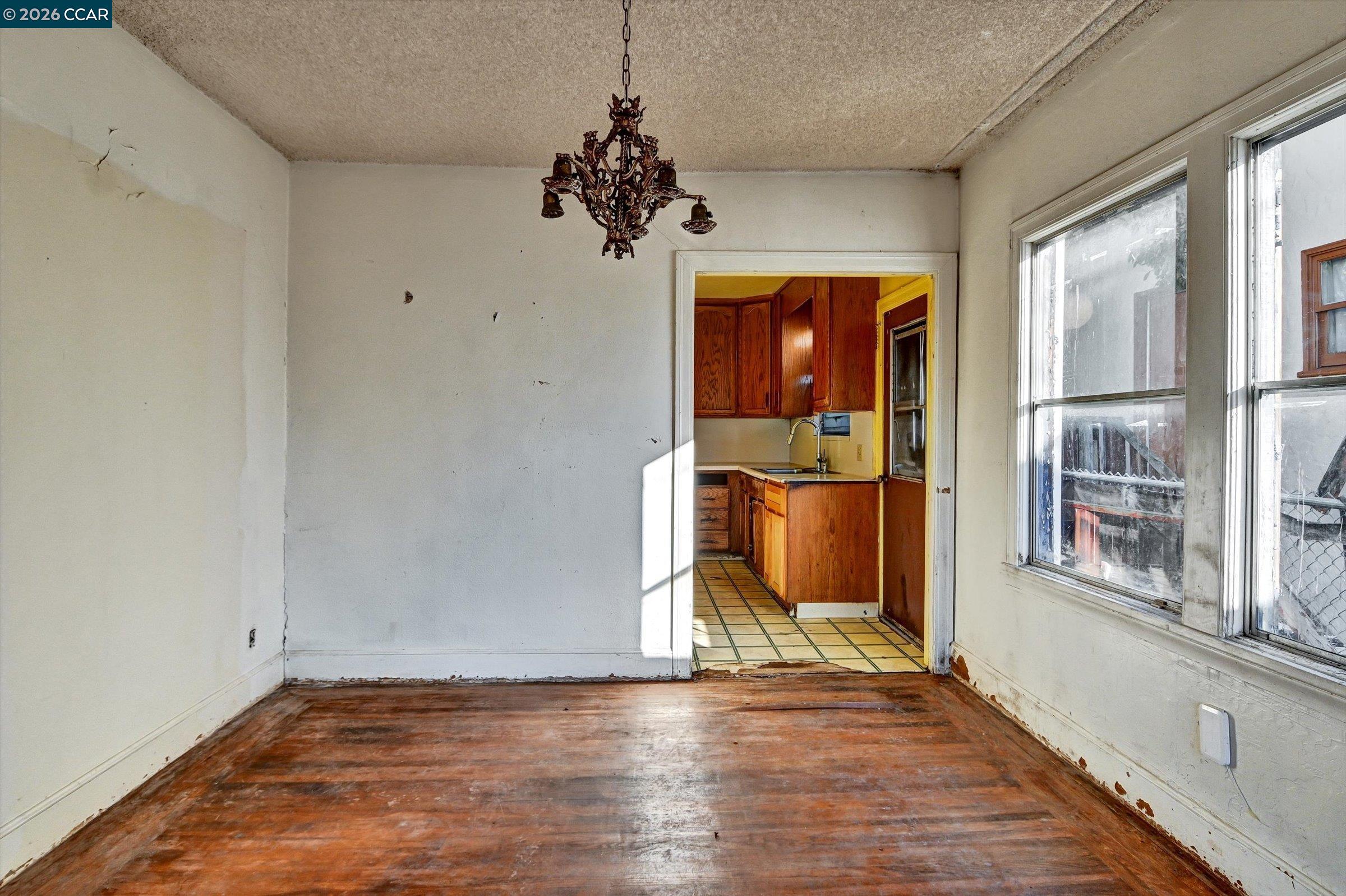 1711 Carleton Street Berkeley, CA 94703 - Photo 6 of 40 a view of empty room with wooden floor and fan