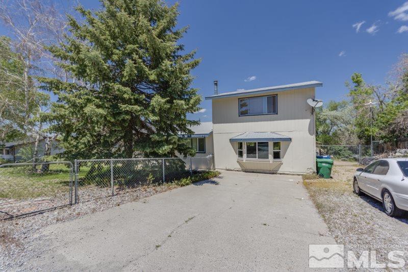 8840 Limnol Street Reno, NV 89506 - Photo 1 of 1 a front view of a house with a yard