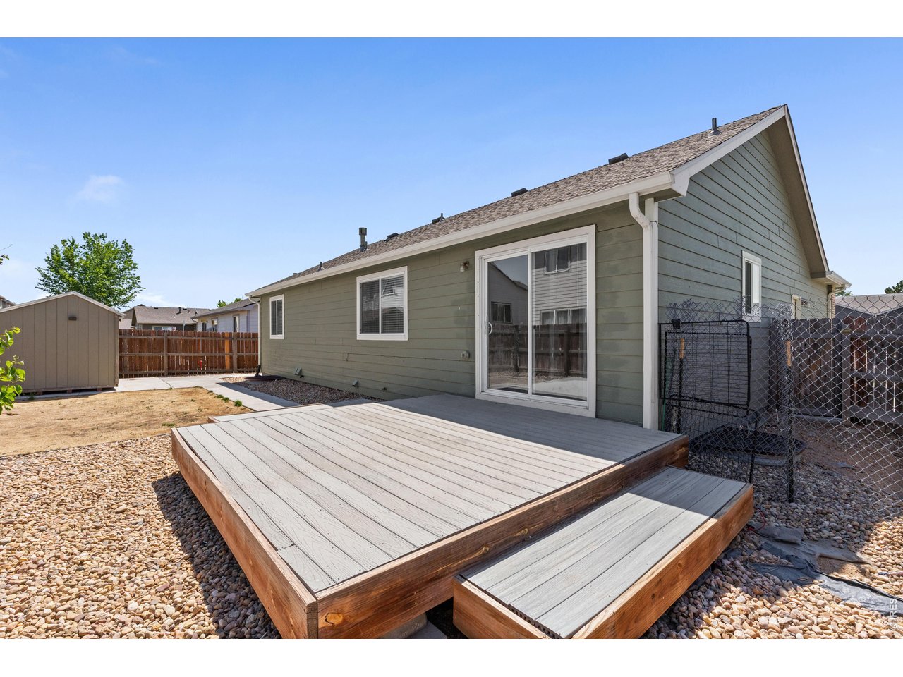 309 East 29th St Road Greeley, CO 80631 - Photo 24 of 31 Spacious back patio fit for entertaining. Patio has weather resistant trex deck