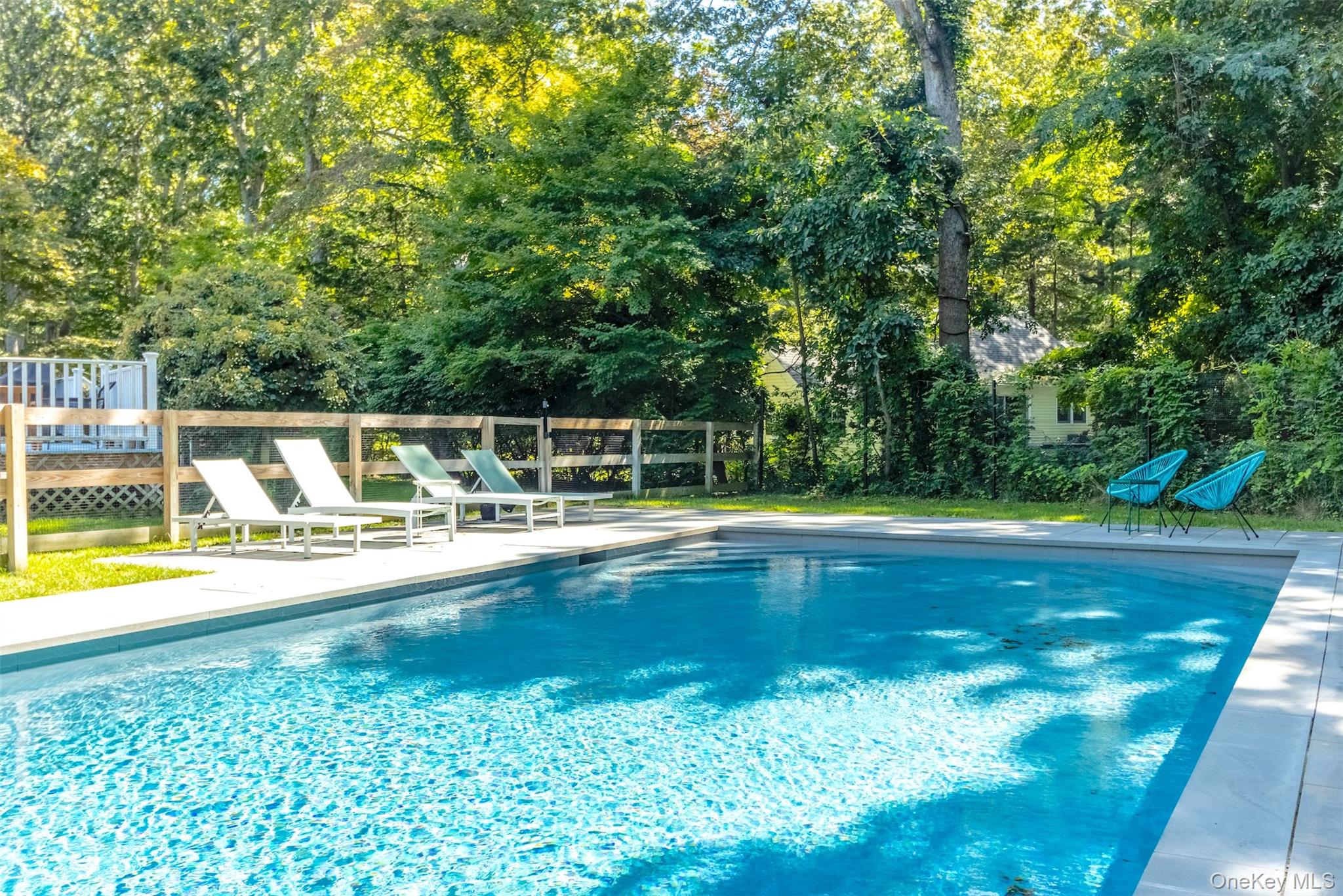 a view of a swimming pool with a patio