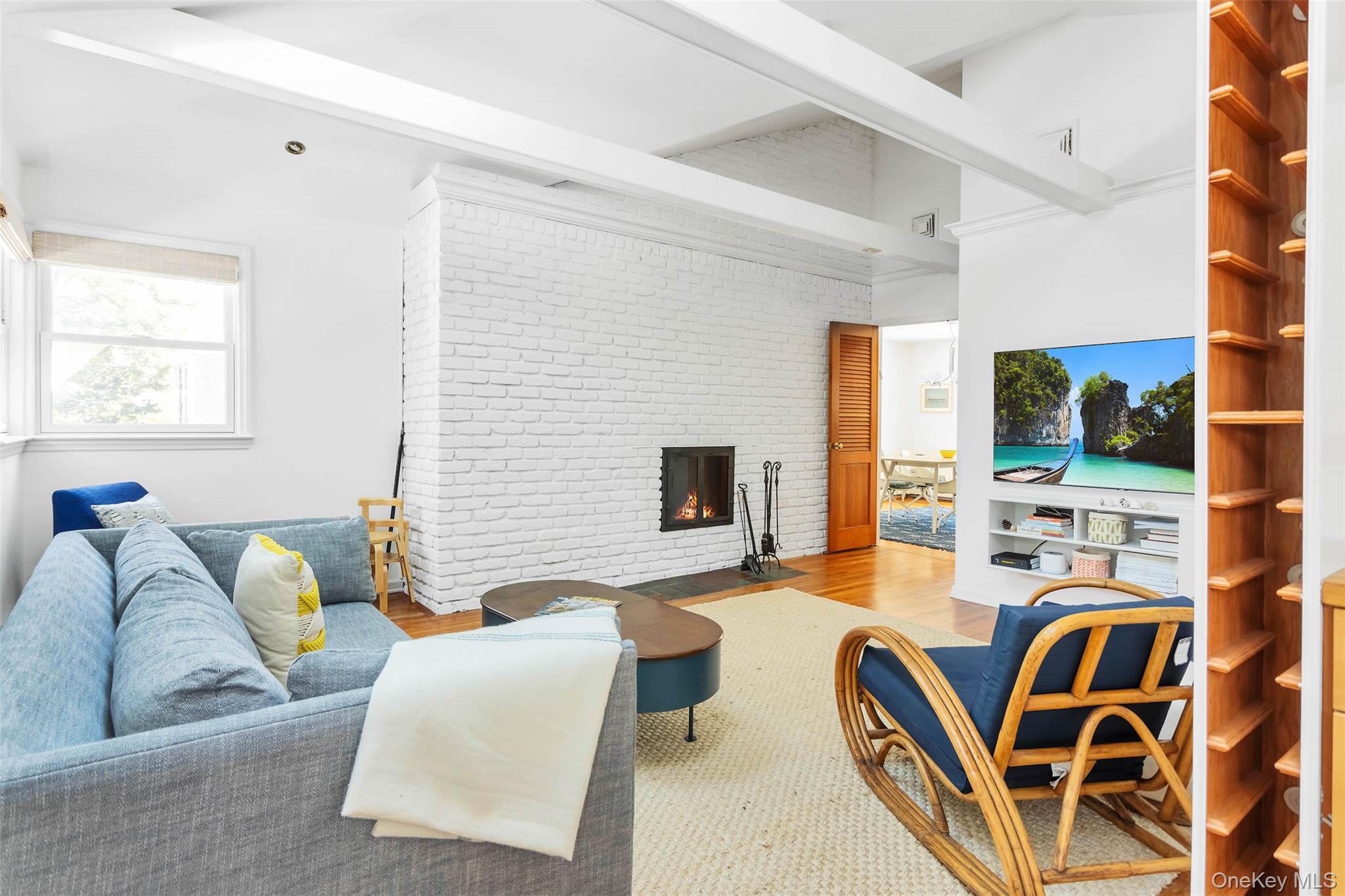 485 Pine Road Southold, NY 11971 - Photo 15 of 39 a living room with patio furniture and a flat screen tv