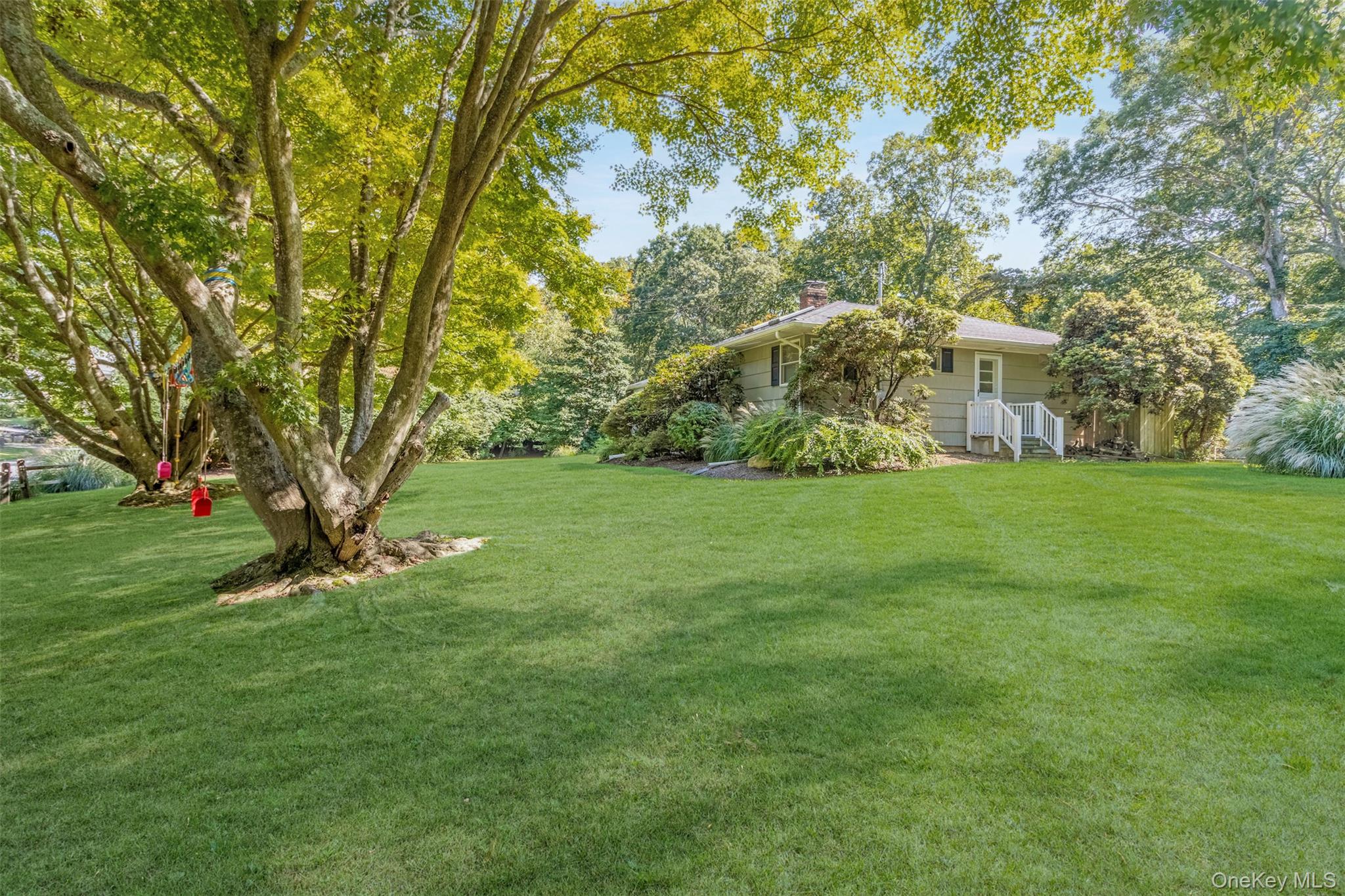 485 Pine Road Southold, NY 11971 - Photo 17 of 39 a view of a house with a yard