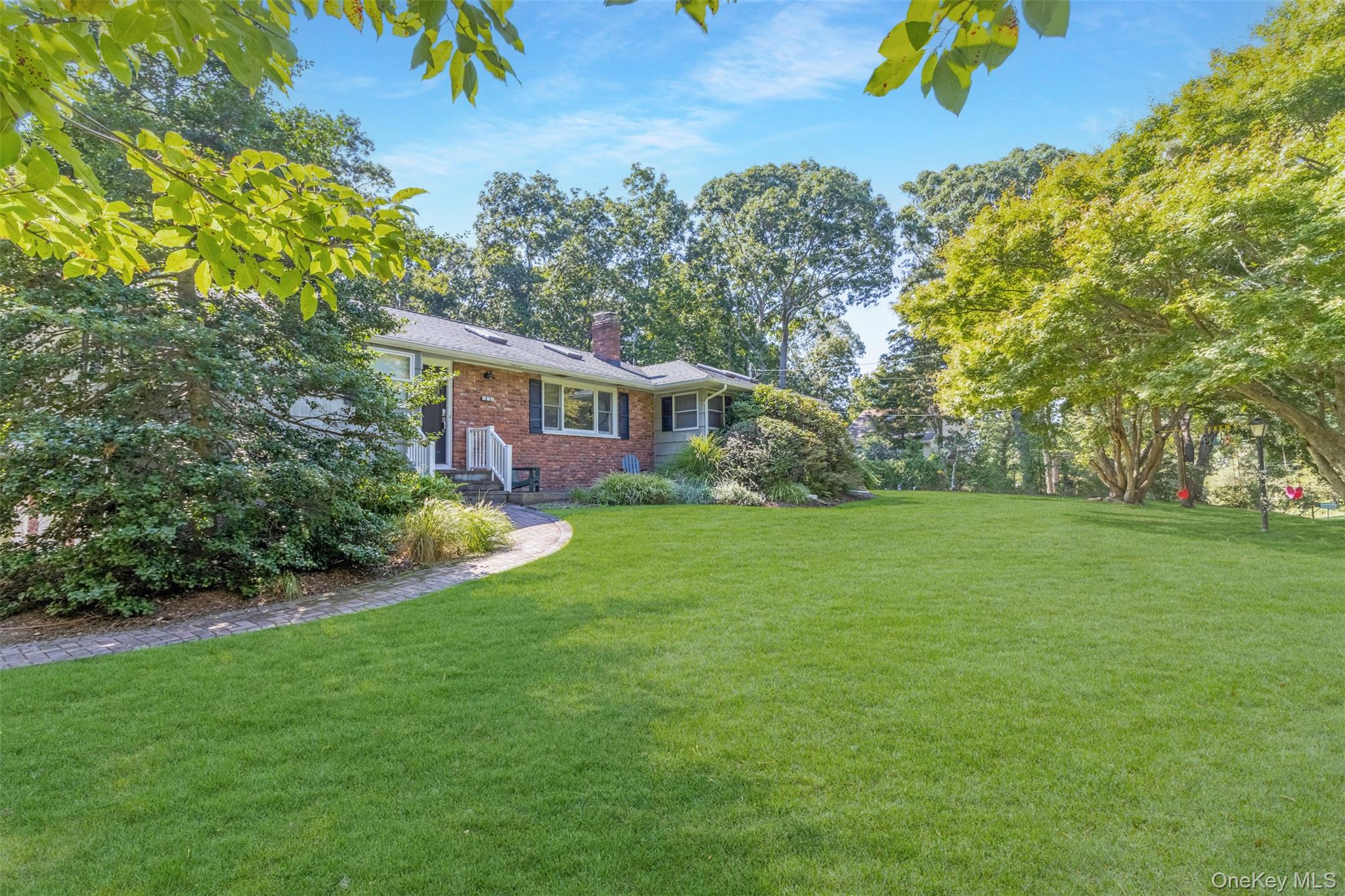 485 Pine Road Southold, NY 11971 - Photo 2 of 39 a view of house with garden space and trees