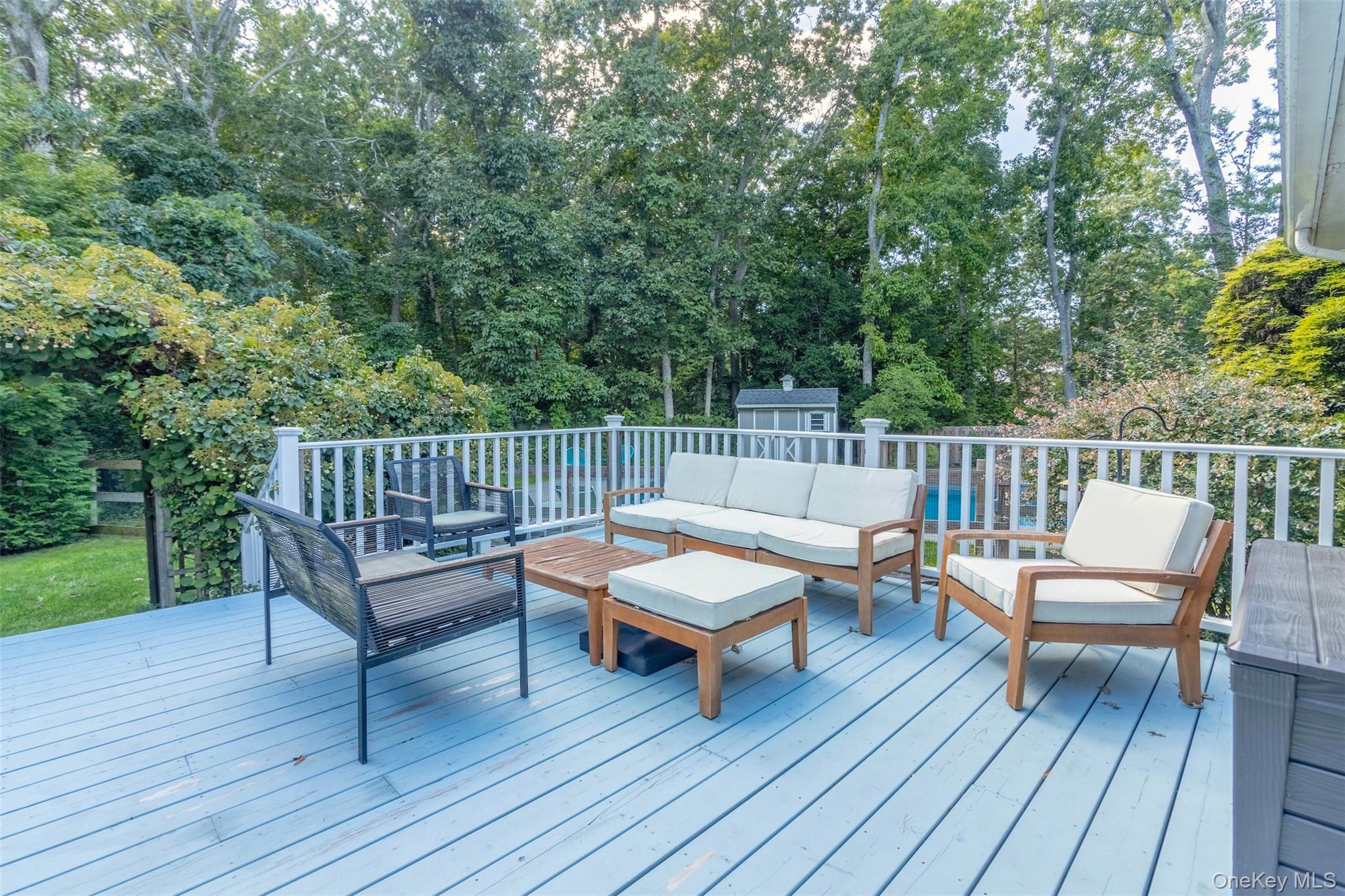 485 Pine Road Southold, NY 11971 - Photo 31 of 39 a outdoor view with a sitting space and large trees