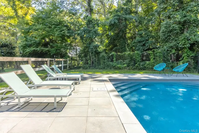 a view of yard with swimming pool