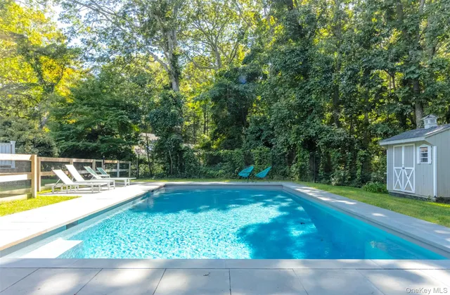 a view of a swimming pool with an outdoor seating