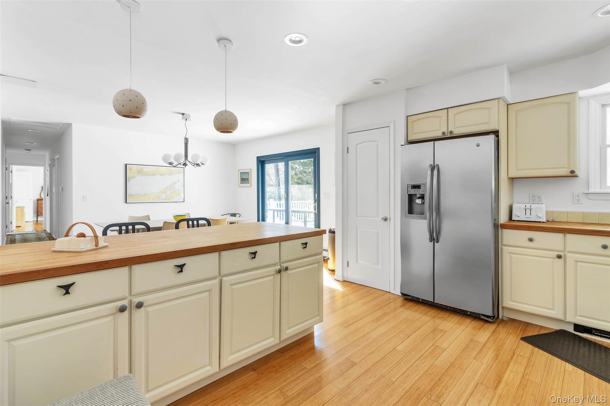 485 Pine Road Southold, NY 11971 - Photo 8 of 39 a large bathroom with a double vanity sink a mirror and a shower