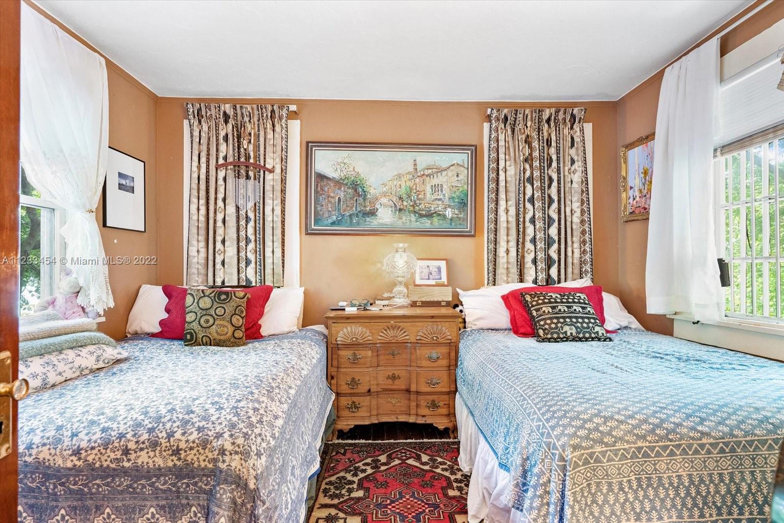 3041 Oak Avenue Coconut Grove, FL 33133 - Photo 18 of 31 a bedroom with a bed and a couch