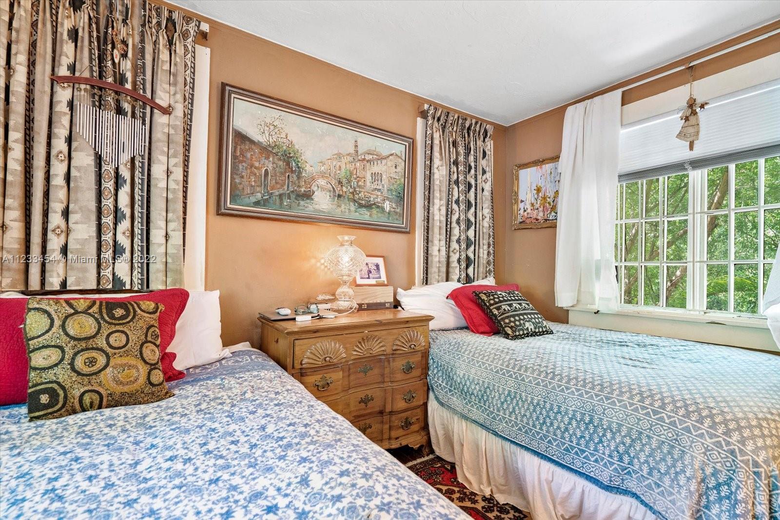 3041 Oak Avenue Coconut Grove, FL 33133 - Photo 19 of 31 a bedroom with a bed and a window