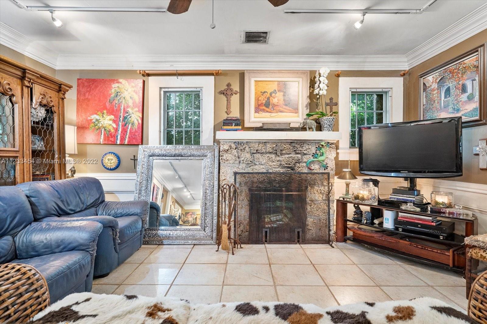 3041 Oak Avenue Coconut Grove, FL 33133 - Photo 2 of 31 a living room with furniture and a flat screen tv