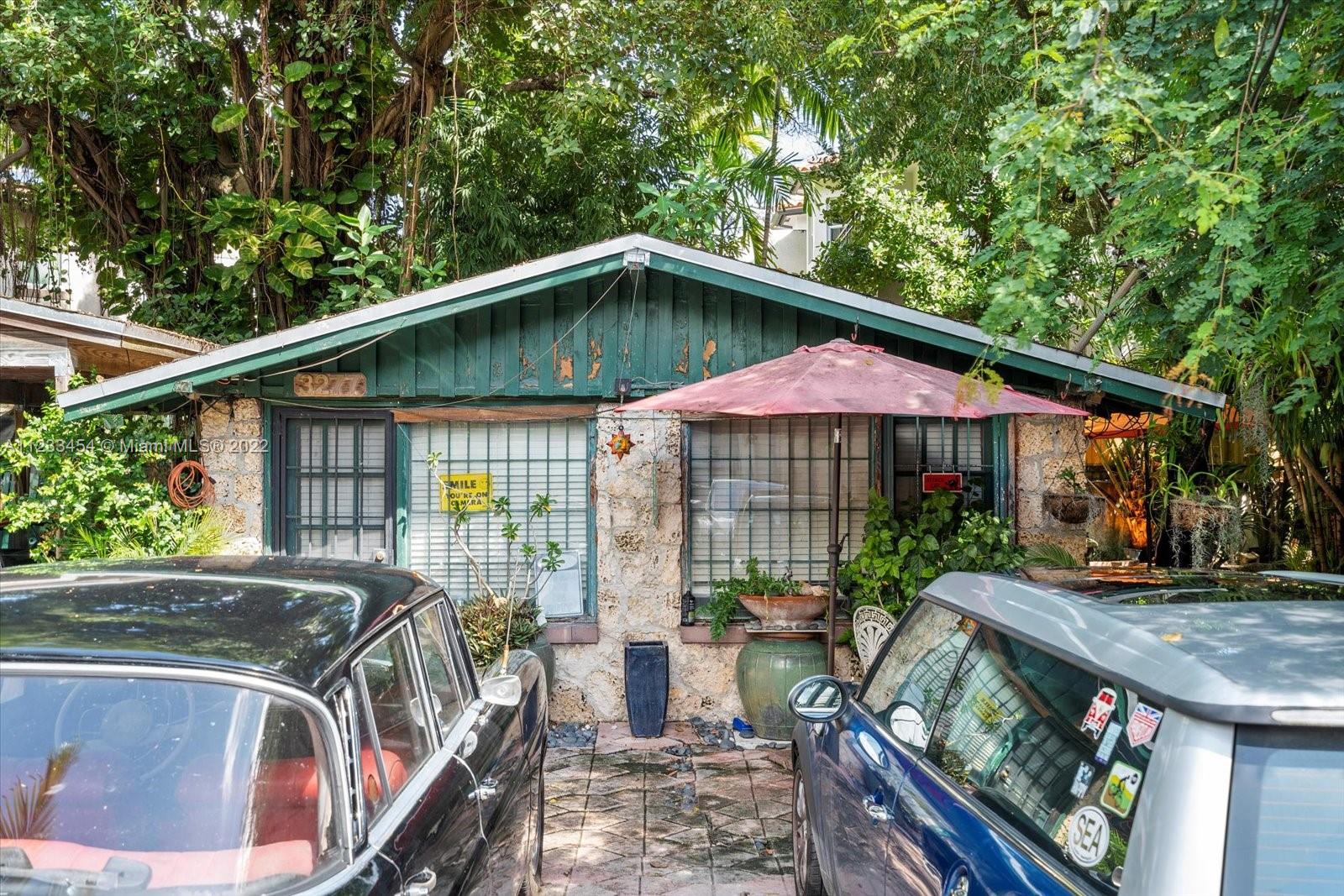 3041 Oak Avenue Coconut Grove, FL 33133 - Photo 25 of 31 a front view of house with yard outdoor seating and barbeque oven
