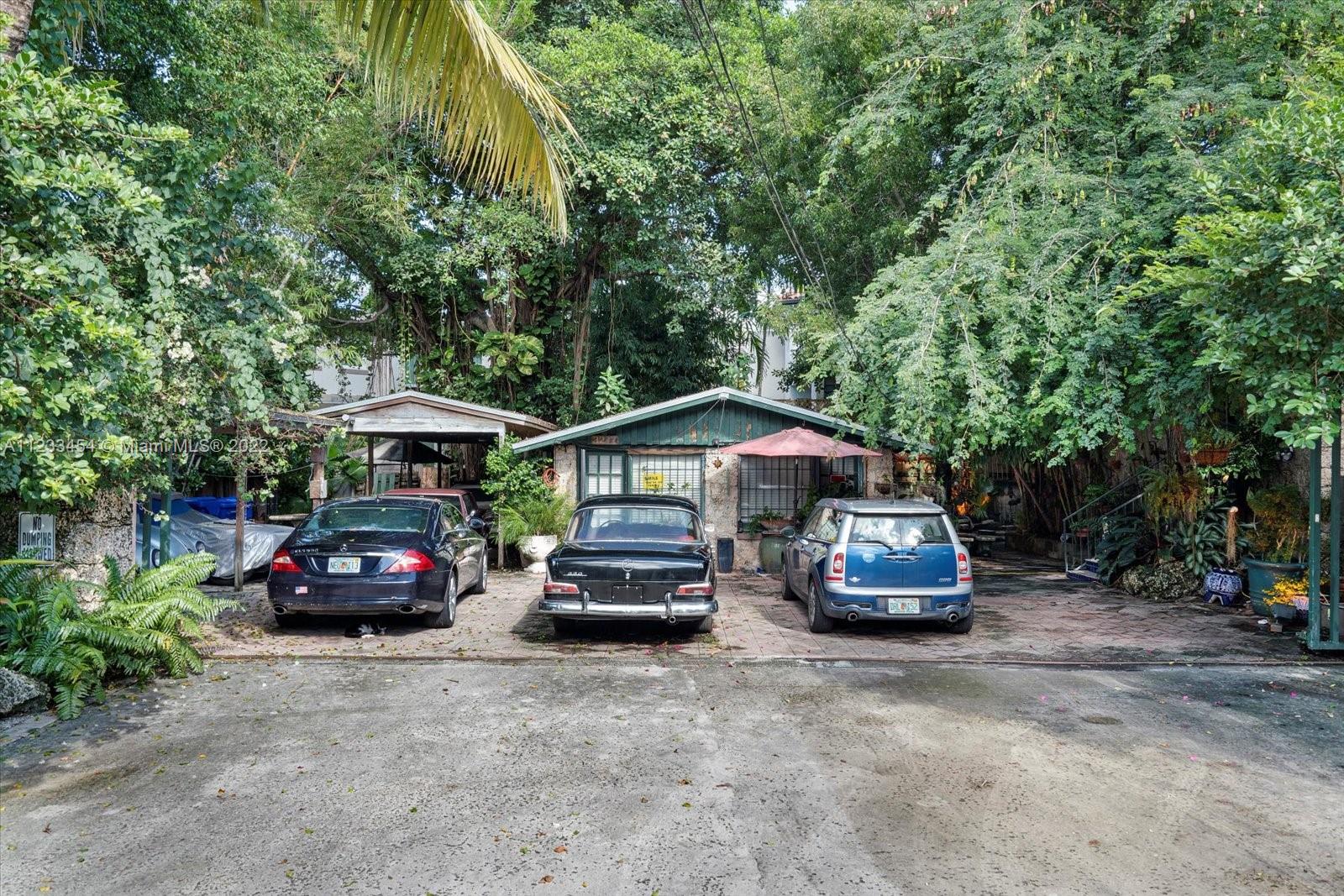 3041 Oak Avenue Coconut Grove, FL 33133 - Photo 27 of 31 a car parked in front of a house