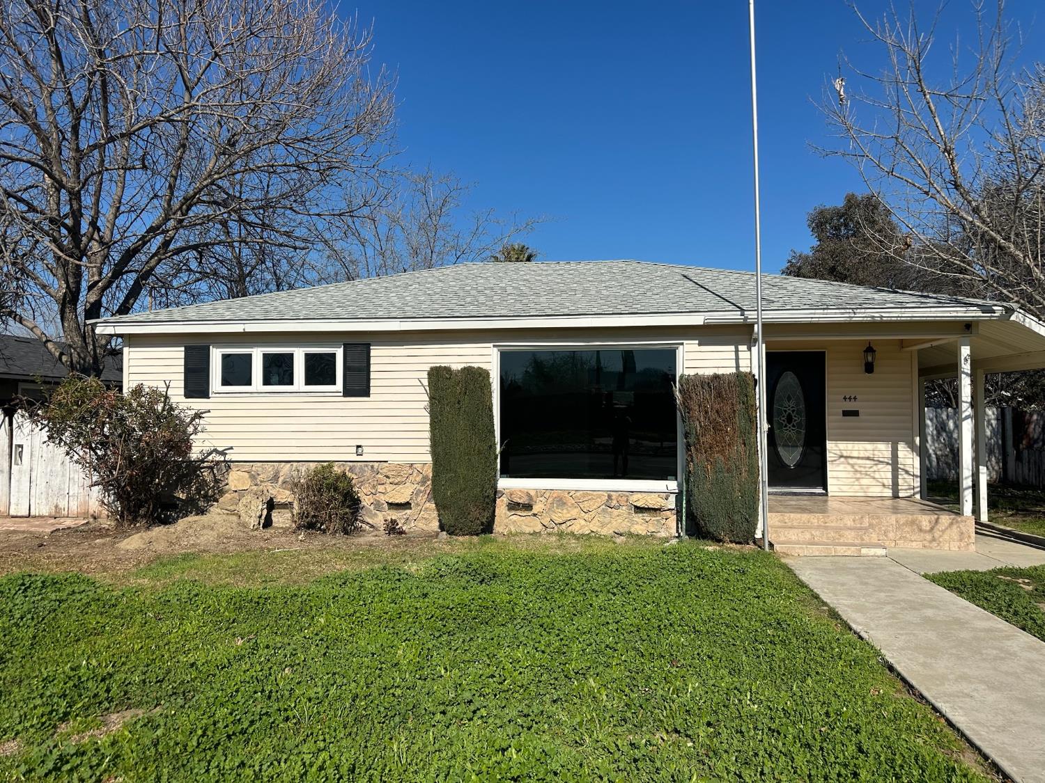 a front view of a house with a yard