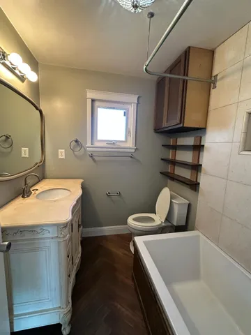 a bathroom with a sink and mirror