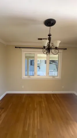 a view of room with a ceiling fan