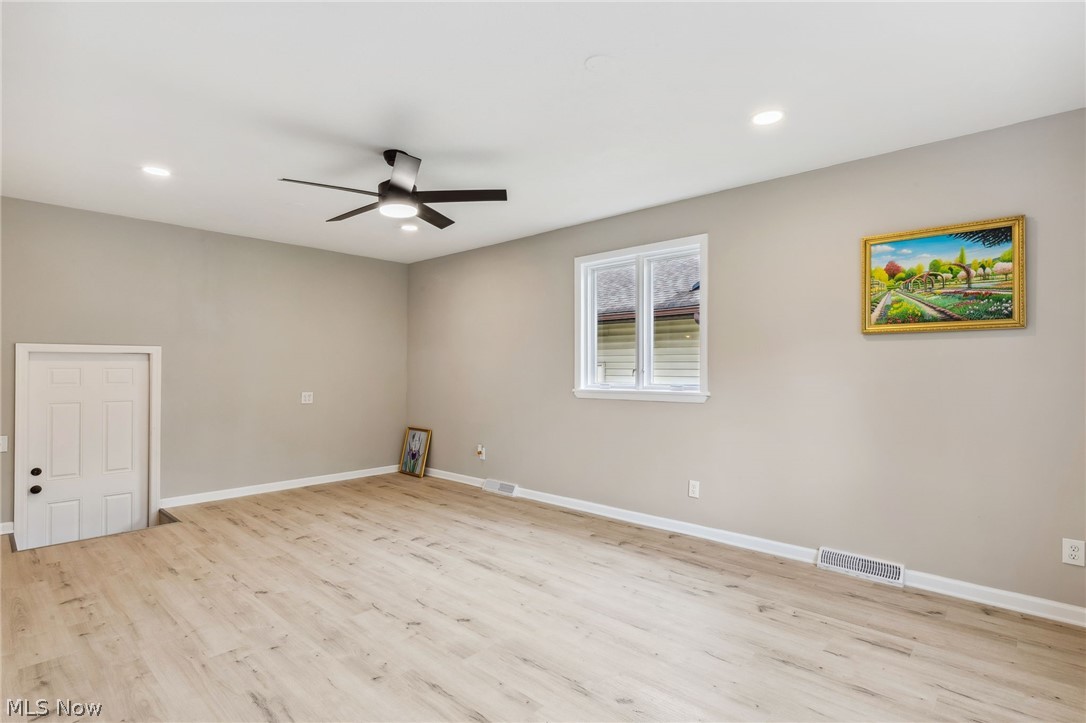 1407 Sunview Road Lyndhurst, OH 44124 - Photo 12 of 33 Spare room featuring light hardwood / wood-style flooring and ceiling fan
