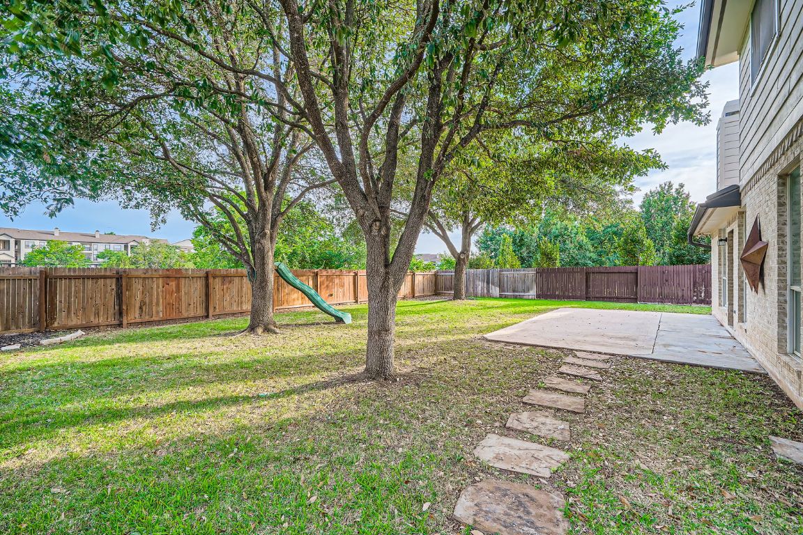 1237 Fall Creek Loop Cedar Park, TX 78613 - Photo 34 of 36 Large patio with mature shade trees