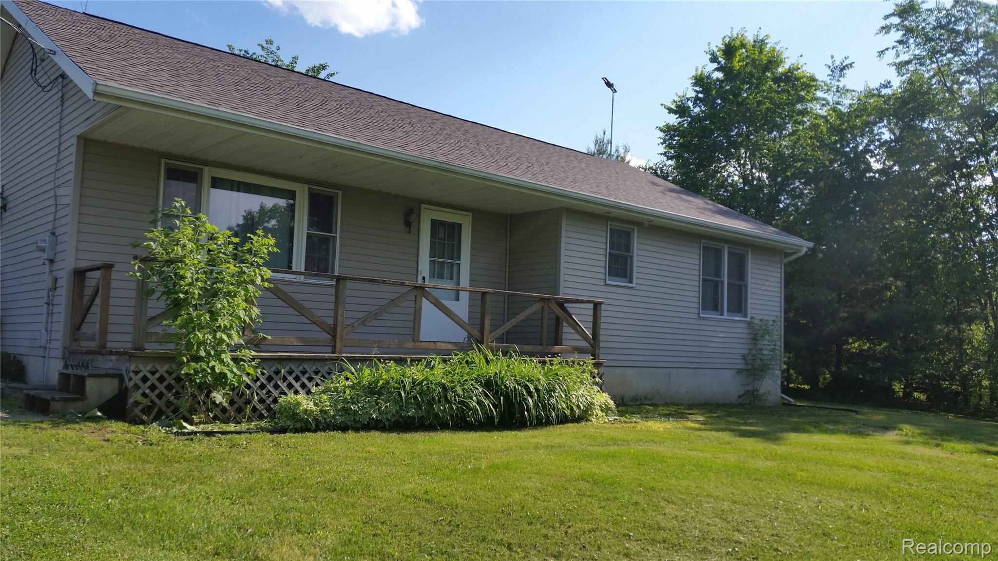 5189 Stewart Road Lapeer, MI 48446 - Photo 1 of 31 5189 stewart summer front view.jpg