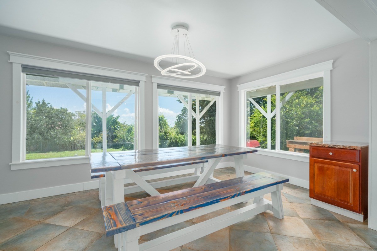 27-571 Kalaoa Camp Road Papaikou, HI 96781 - Photo 12 of 29 a view of a living room and a large window
