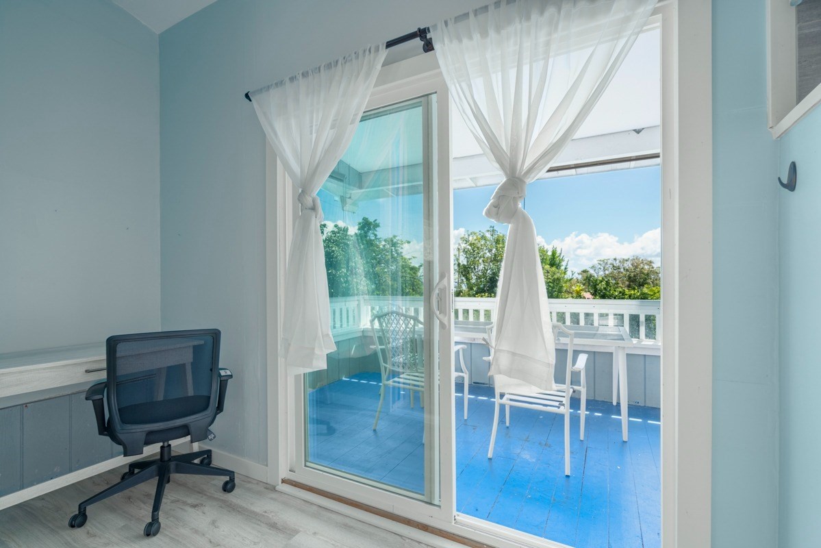 27-571 Kalaoa Camp Road Papaikou, HI 96781 - Photo 20 of 29 a view of a room with a window and a chair
