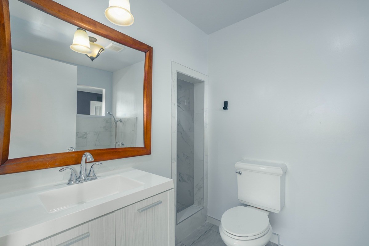 27-571 Kalaoa Camp Road Papaikou, HI 96781 - Photo 23 of 29 a bathroom with a sink and a toilet