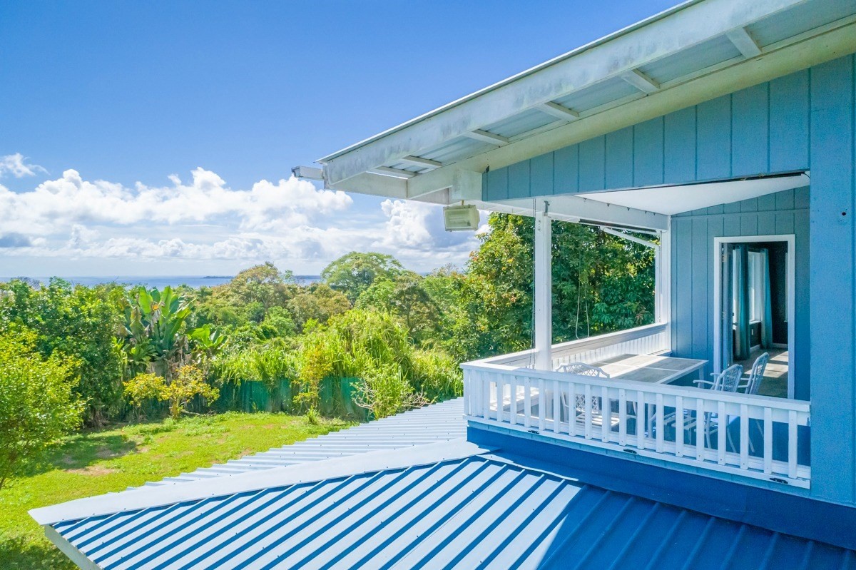 27-571 Kalaoa Camp Road Papaikou, HI 96781 - Photo 5 of 29 a view of a patio with wooden floor