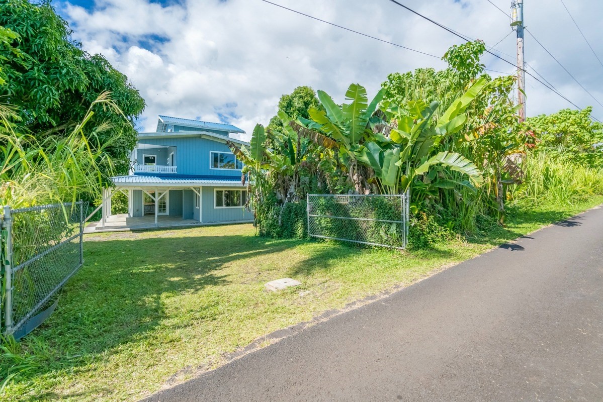 27-571 Kalaoa Camp Road Papaikou, HI 96781 - Photo 8 of 29 a view of a house with a yard