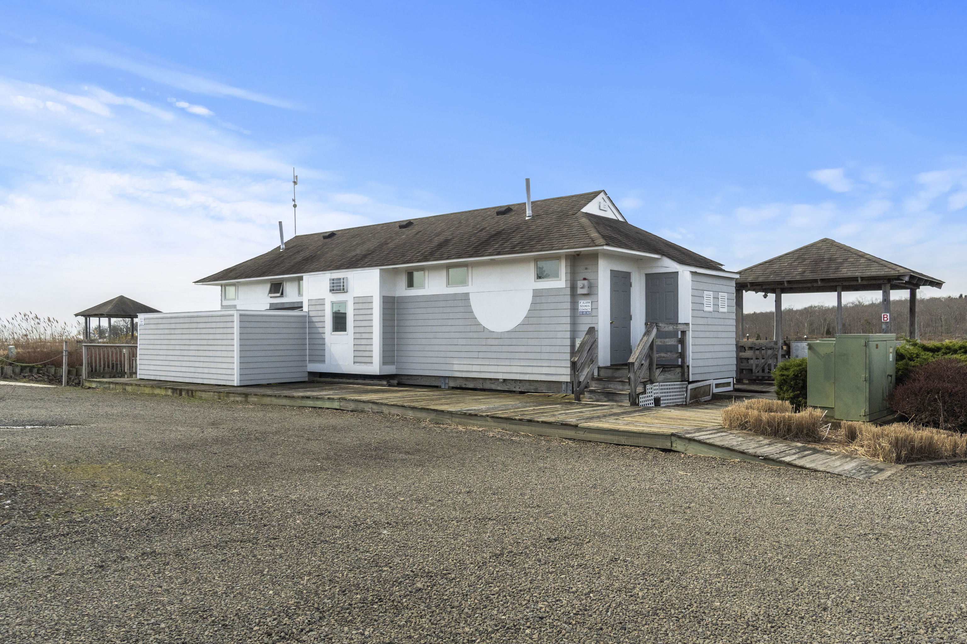 379 Whitfield Street, Unit CN946 Guilford, CT 06437 - Photo 4 of 7 a front view of a house with a yard