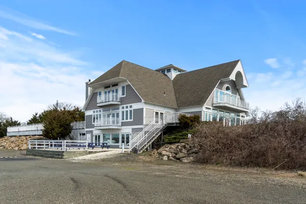 a view of multiple houses with a street