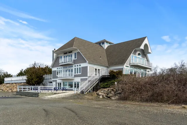 a view of multiple houses with a street