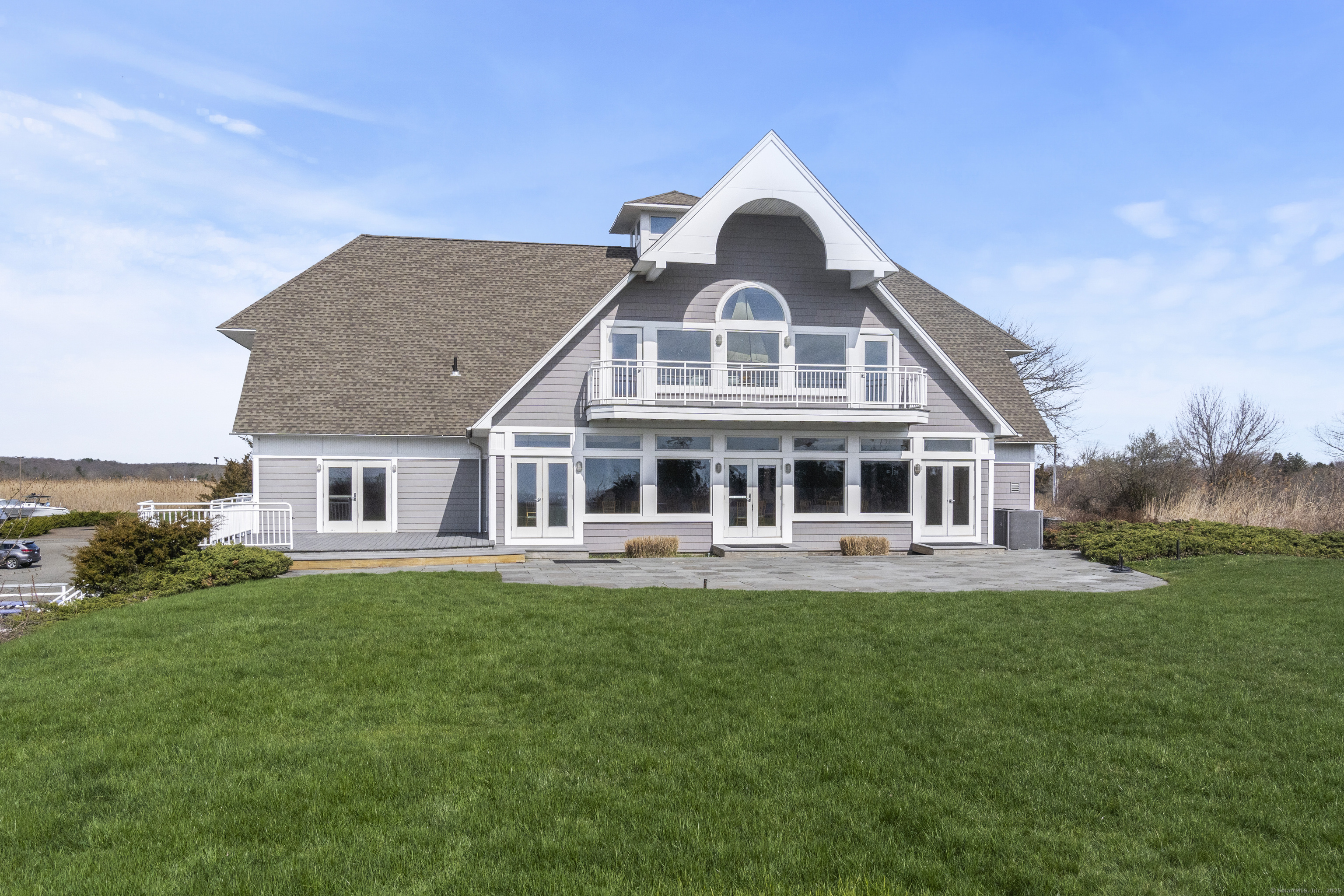 379 Whitfield Street, Unit CN946 Guilford, CT 06437 - Photo 6 of 7 a front of a house with a garden
