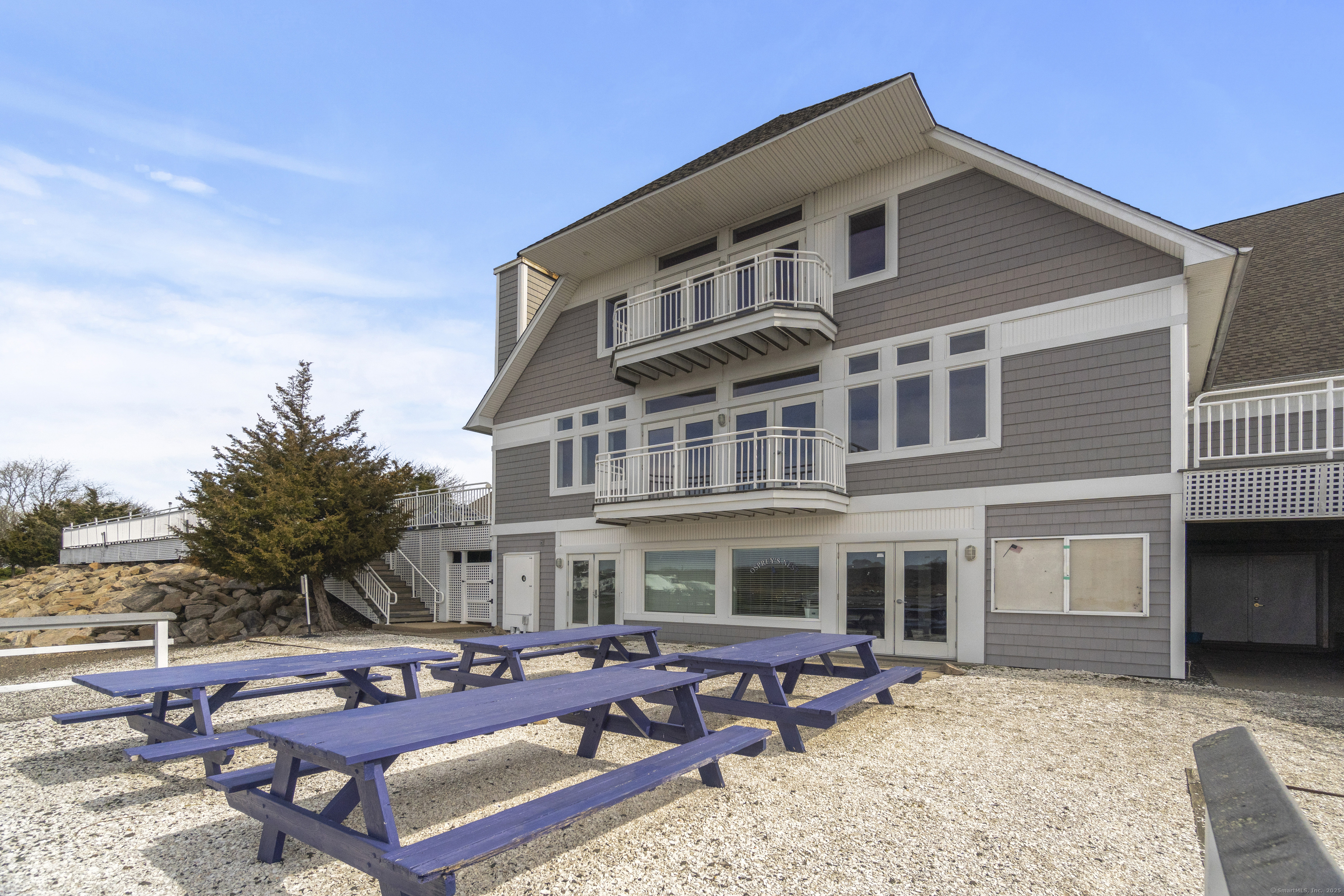 379 Whitfield Street, Unit CN946 Guilford, CT 06437 - Photo 7 of 7 a front view of a house with outdoor seating