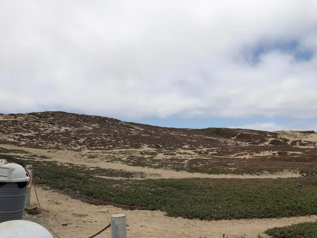 a view of an ocean and a mountain