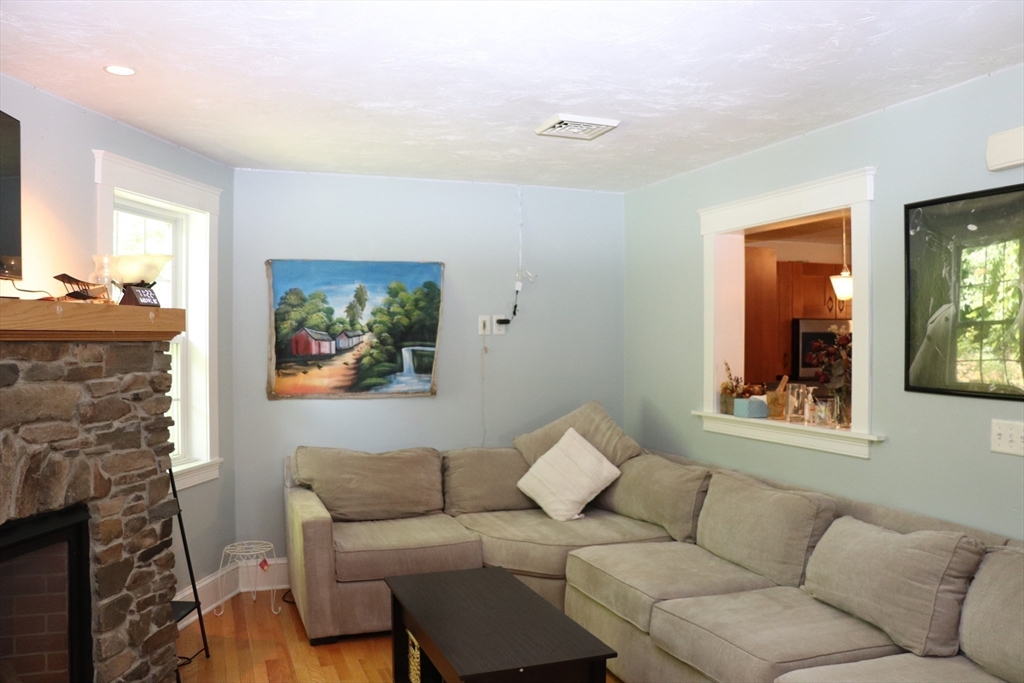 60 Edgehill Road Braintree, MA 02184 - Photo 11 of 30 a living room with furniture and a fireplace
