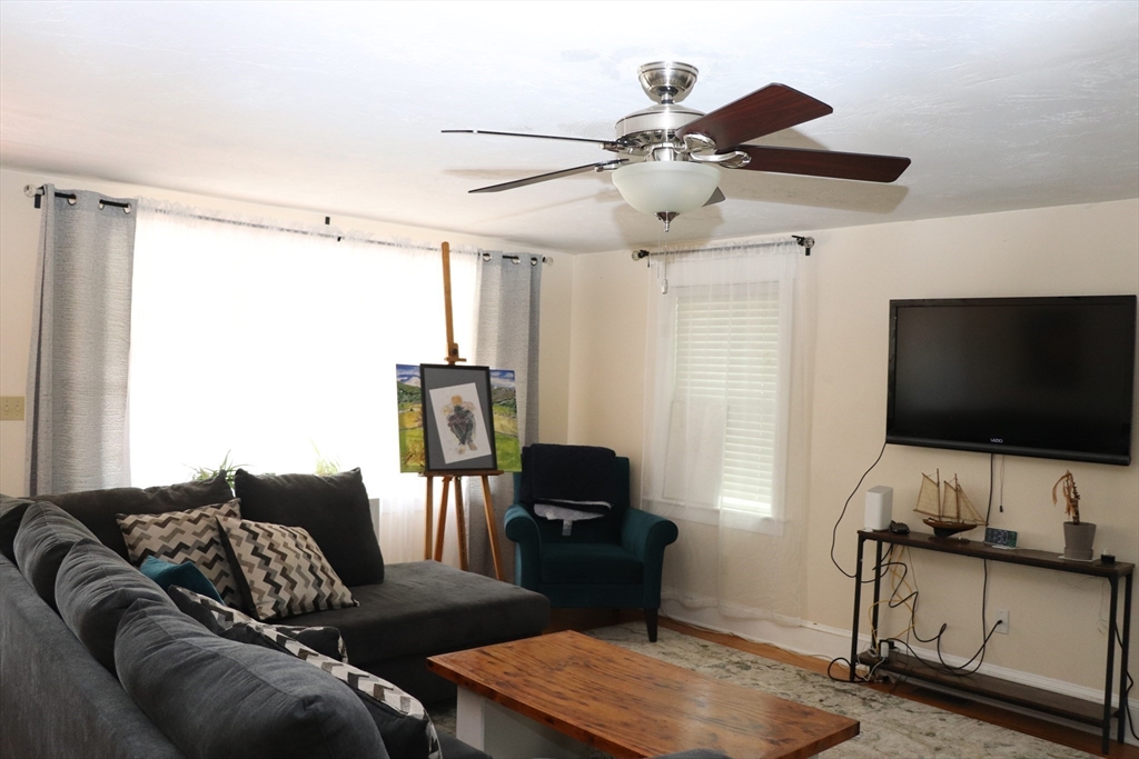 60 Edgehill Road Braintree, MA 02184 - Photo 14 of 30 a living room with furniture and a flat screen tv