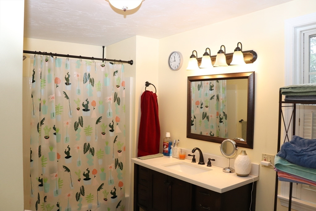60 Edgehill Road Braintree, MA 02184 - Photo 23 of 30 a bathroom with a sink and a mirror