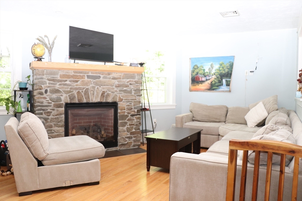 60 Edgehill Road Braintree, MA 02184 - Photo 10 of 30 a living room with furniture and a fireplace
