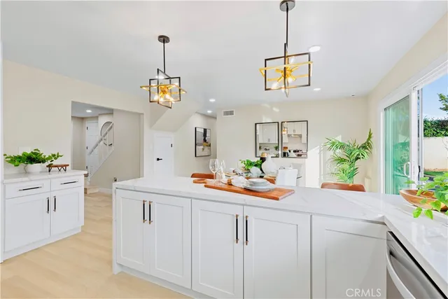 a bathroom with a granite countertop toilet sink and mirror