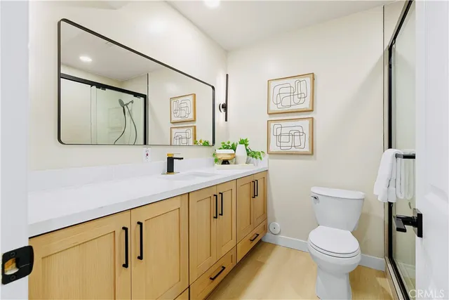 a bedroom with a bed and a potted plant