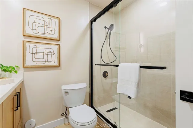 a bed room with a bed and a view of living room