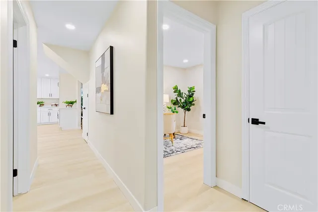 a bedroom with furniture and a potted plant