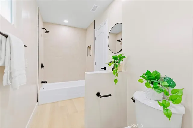 a view of a house with a yard and a garden