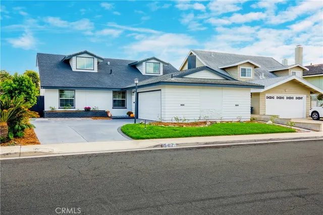 an aerial view of houses with outdoor space