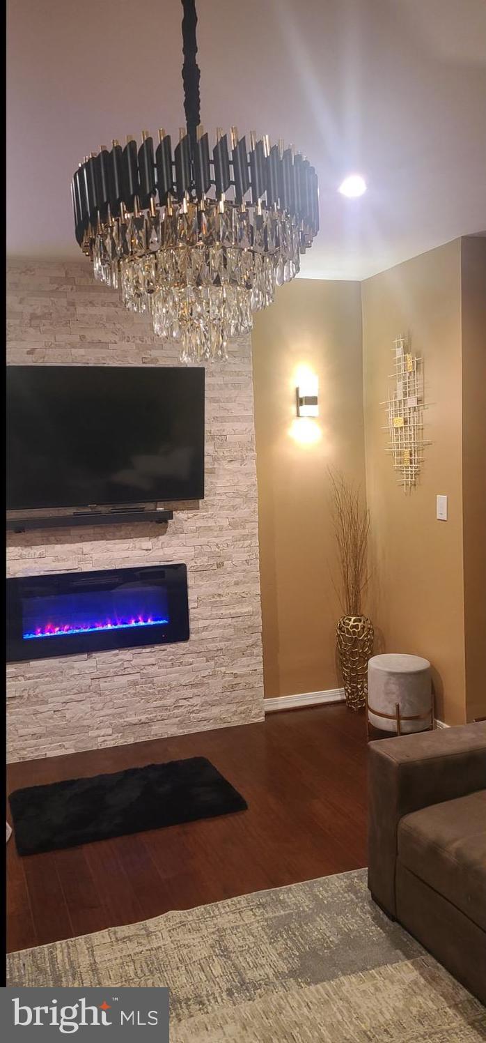 6346 Rockshire Street Alexandria, VA 22315 - Photo 3 of 10 a view of a living room with a rug and a fireplace