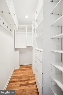 a hallway view with cabinets