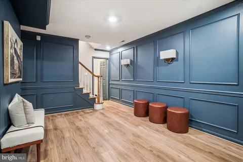 a room with wooden floor and furniture