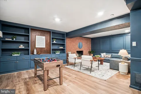 a living room with furniture a rug and a wooden floor